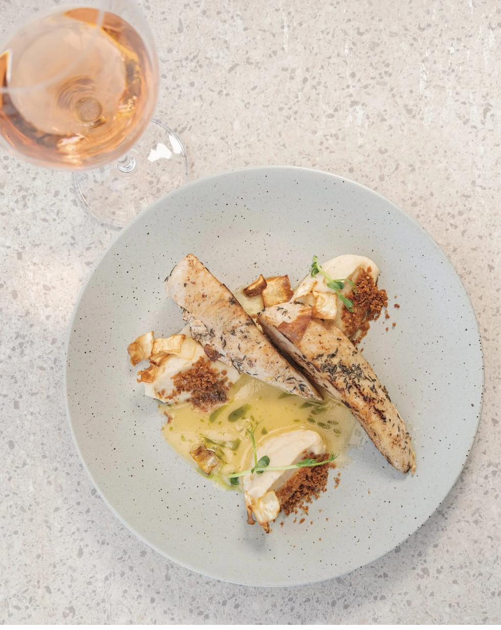 Mediterranean fish dish with rosé wine